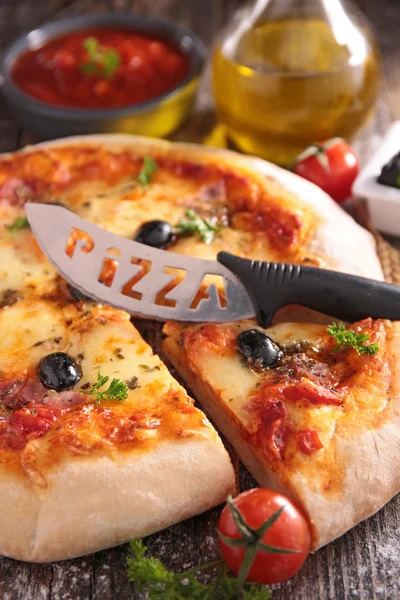 Pepperoni pizza with knife — Stock Photo, Image