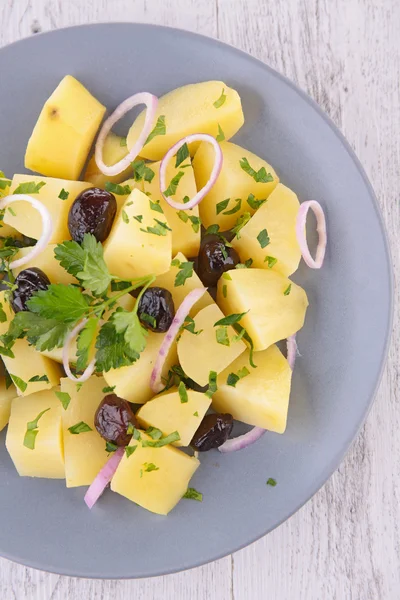 Fresh salad with potatoes in plate — Stock Photo, Image