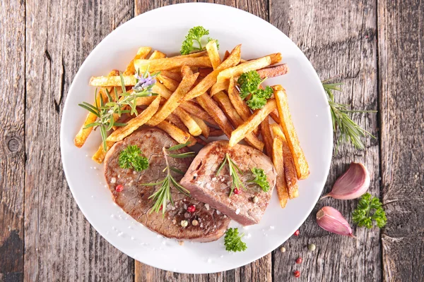 Grilled steak and french fries — Stock Photo, Image