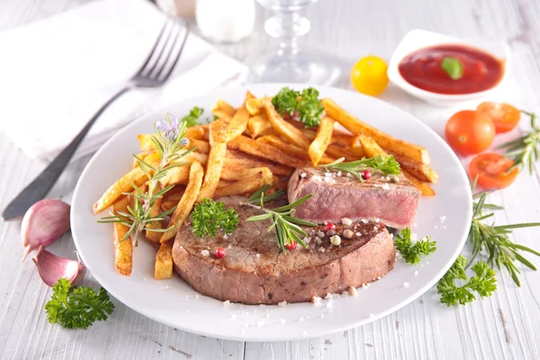 Grilled steak and french fries — Stock Photo, Image