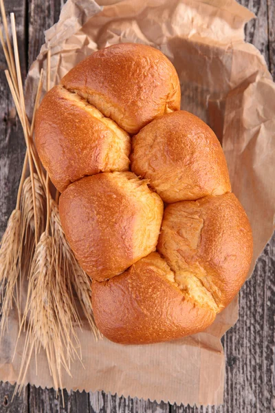 Brown fresh bread on wood — Stock Photo, Image