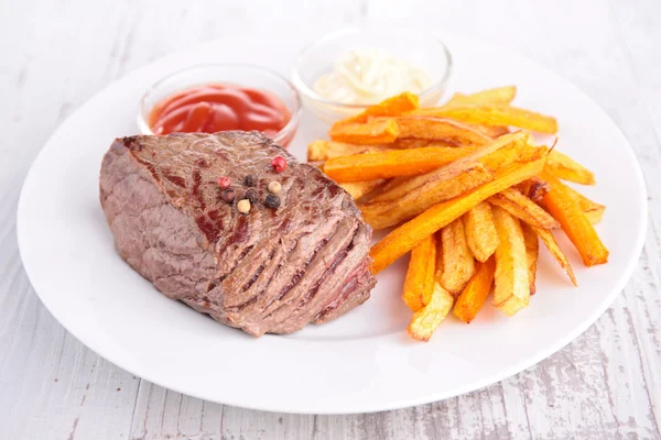 Beef and french fries — Stock Photo, Image