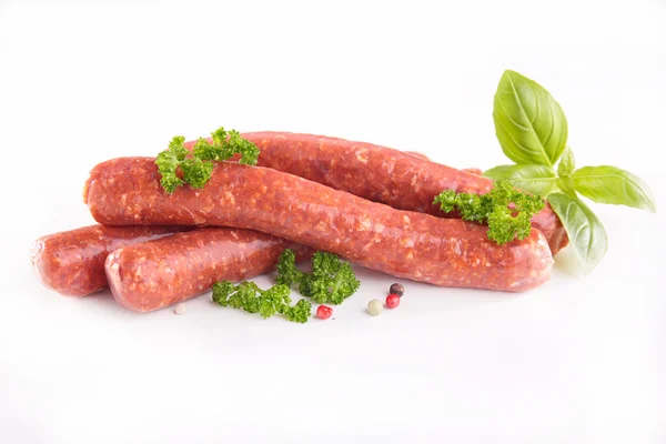 Raw sausages on white background — Stock Photo, Image