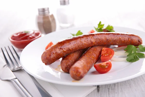 Grilled sausages in white plate — Stock Photo, Image