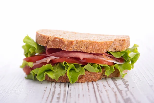 Tasty sandwich on wooden table — Stock Photo, Image