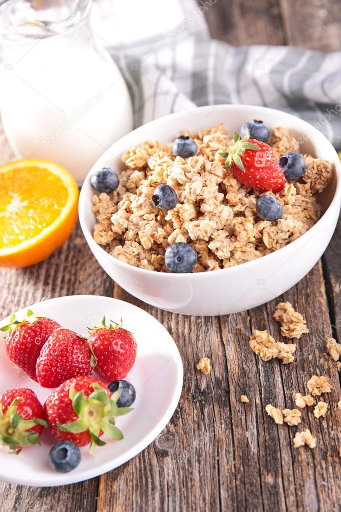 Granola with berries and milk