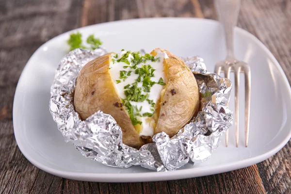 Baked potato with cream — Stock Photo, Image