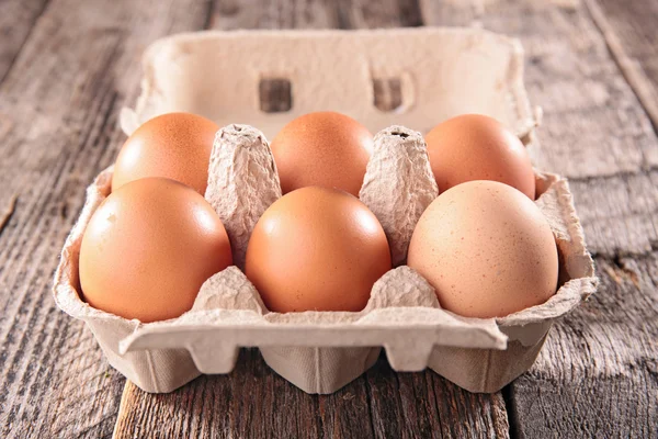 Fresh eggs in egg box — Stock Photo, Image