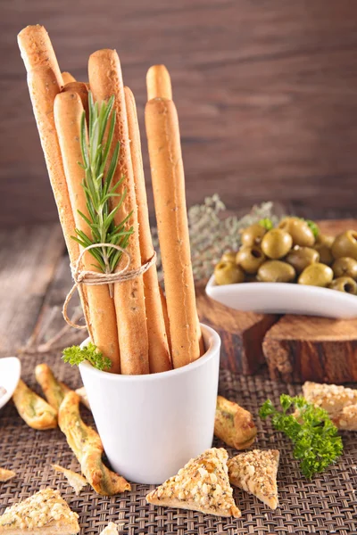 Grissini with green olives — Stock Photo, Image