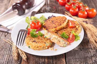 Quinoa cakes with vegetables clipart
