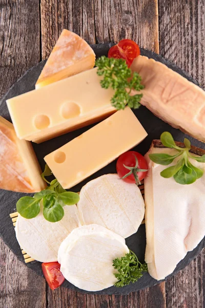 Cheese with cherry tomatoes and herbs — Stock Photo, Image