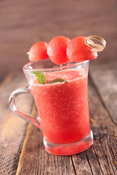 Watermelon juice with watermelon balls on stick — Stock Photo, Image