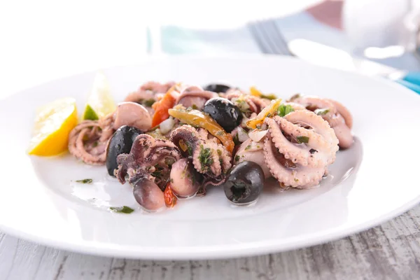 Seafood salad with black olives — Stock Photo, Image