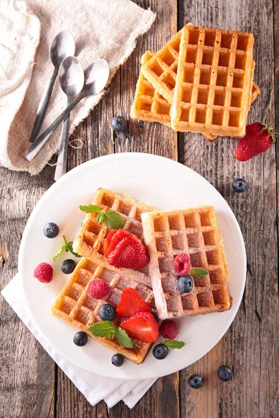 Waffles with berries on table — Stock Photo, Image