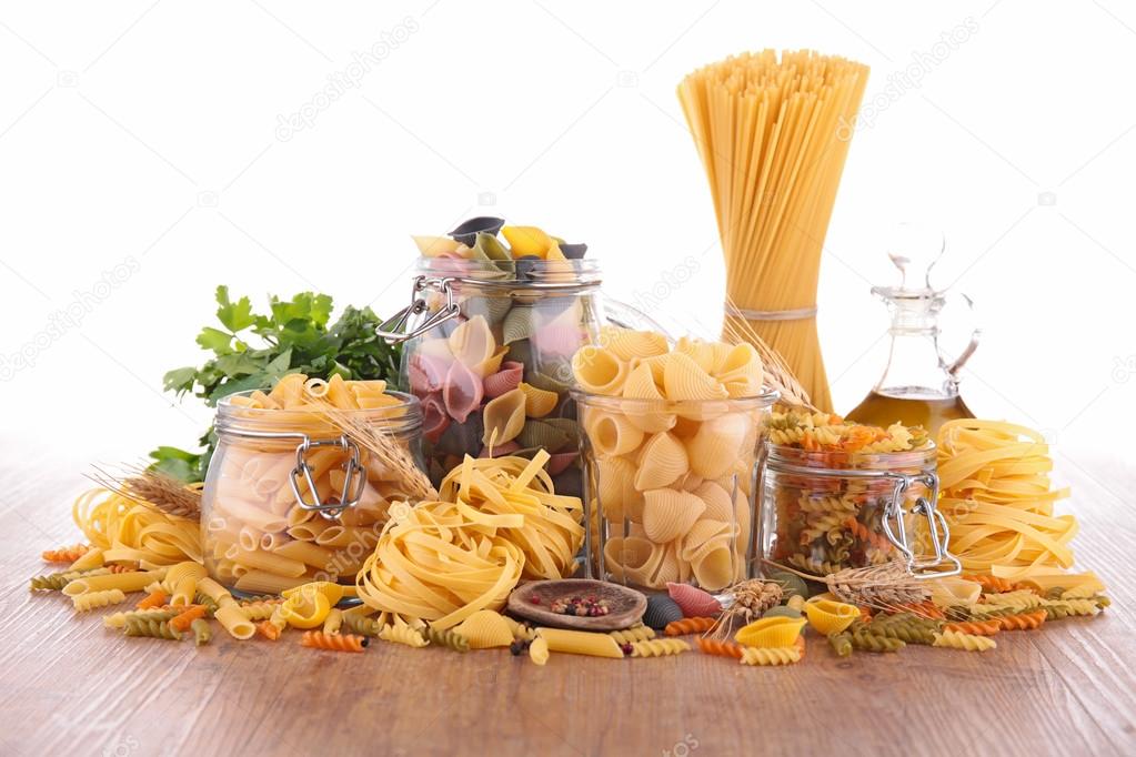 Raw different type of pasta in jars