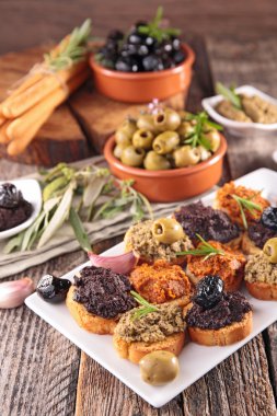 Canape with tapenade and olives clipart