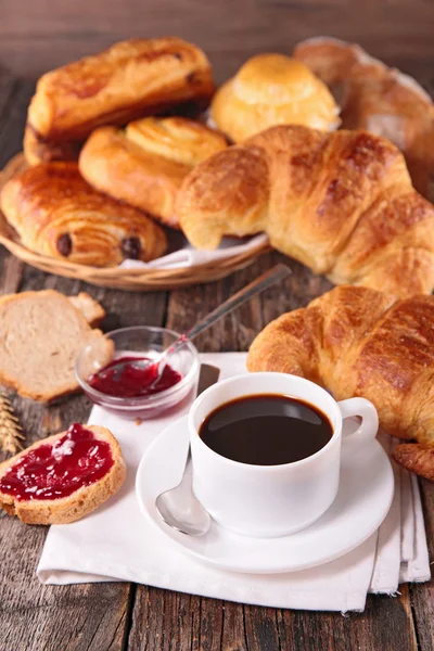 Breakfast with coffee cup and pastries — Stock Photo, Image