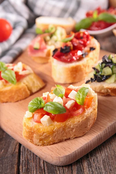Bruschetta and other ingredients — Stock Photo, Image