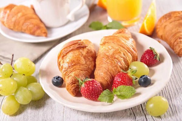 Breakfast with coffee, croissant and fruits — Stock Photo, Image