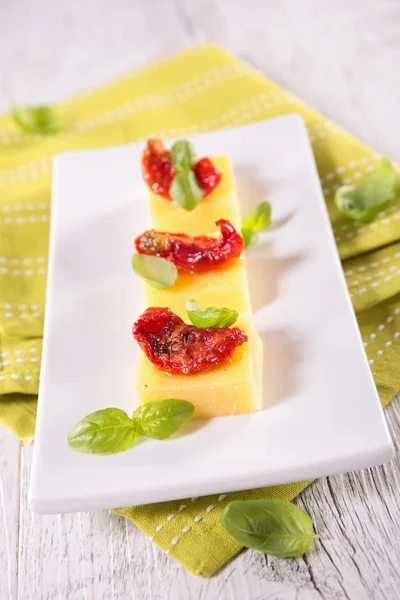 Appetizer, polenta and tomato — Stock Photo, Image