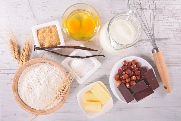 Cake ingredients on wood — Stock Photo, Image