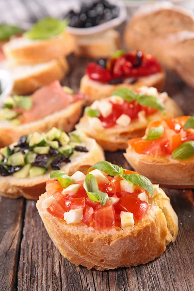 Assorted bruschetta appetizers — Stock Photo, Image