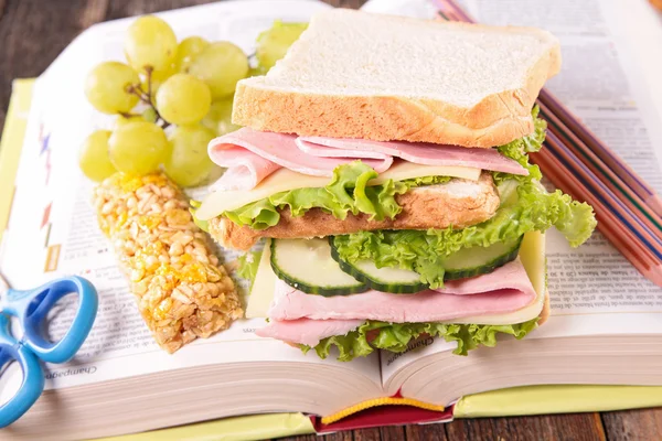 school lunch with sandwich on book