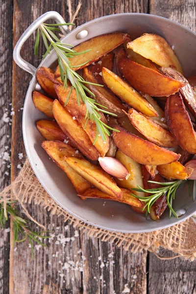 Fried potato and rosemary — Stock Photo, Image