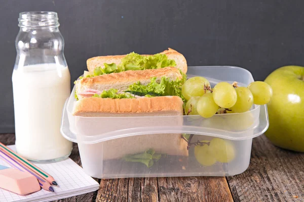 Lunch box with sandwich and grapes — Stock Photo, Image