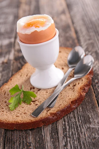 Boiled egg and bread — Stock Photo, Image