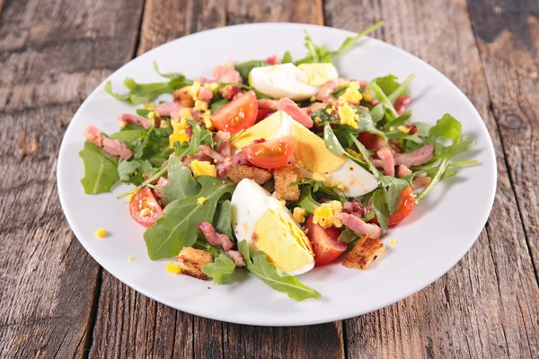 Salad with egg and bacon — Stock Photo, Image