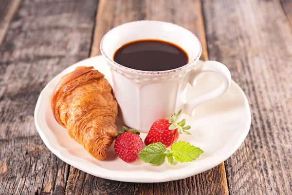 Coffee cup and croissant — Stock Photo, Image