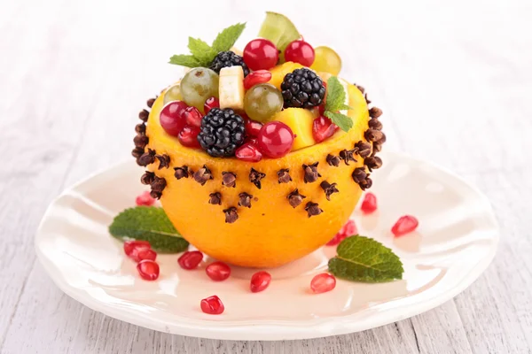 Fruit salad in orange bowl — Stock Photo, Image