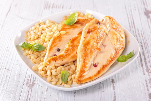 Chicken breast and barley — Stock Photo, Image