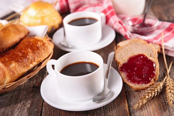 Coffee cups, croissant and milk — Stock Photo, Image