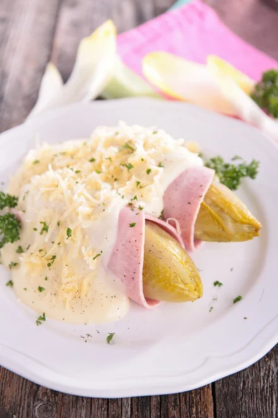 Baked chicory with cheese — Stock Photo, Image