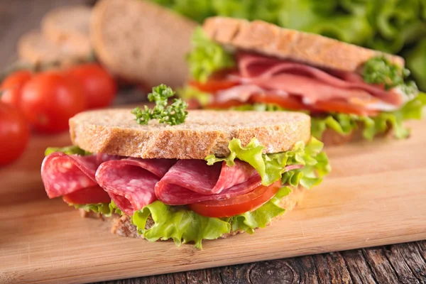 Sandwiches with salami and lettuce — Stock Photo, Image