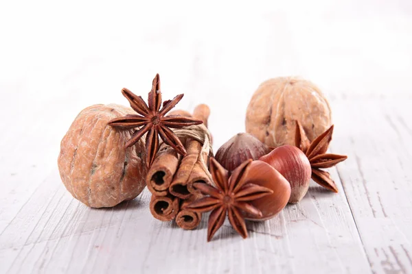 Cinnamon, anise and walnuts — Stock Photo, Image