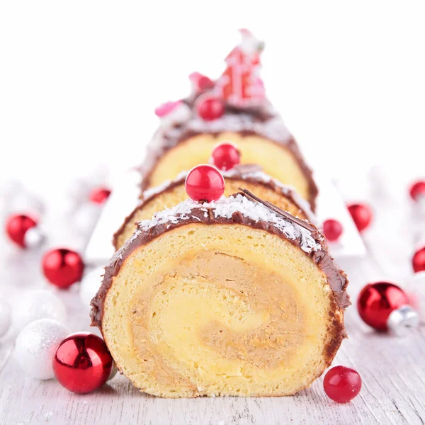 Christmas log with decorations — Stock Photo, Image