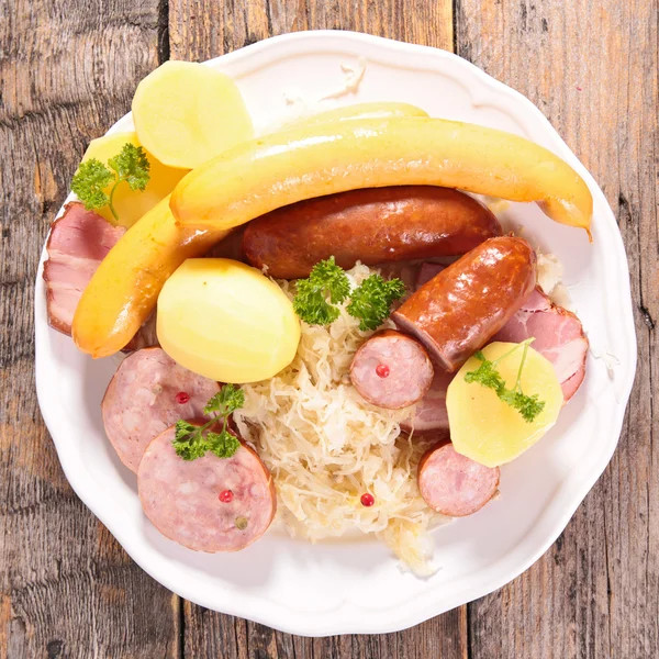 Sauerkraut, sour cabbage with sausages — Stock Photo, Image