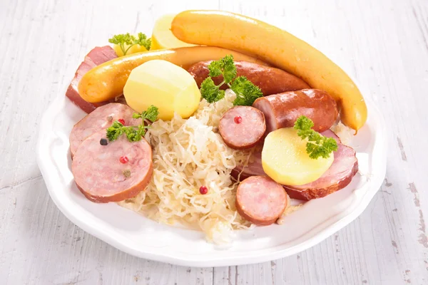 Sauerkraut, sour cabbage with sausages — Stock Photo, Image