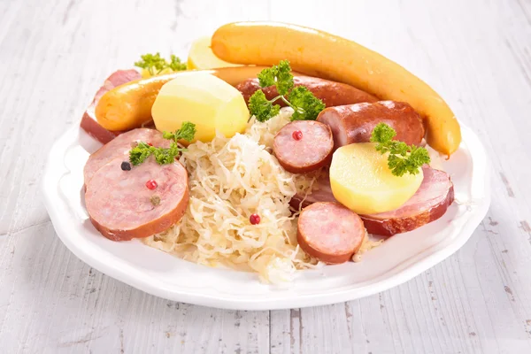 Sour cabbage with sausages — Stock Photo, Image