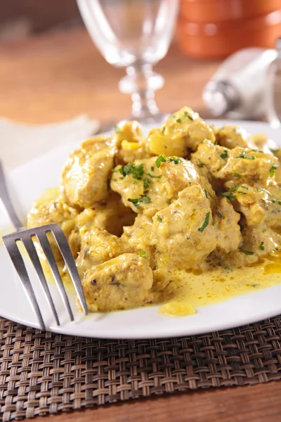 Chicken and curry sauce — Stock Photo, Image