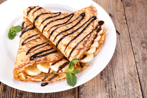 Crepe with chocolate and bananas — Stock Photo, Image