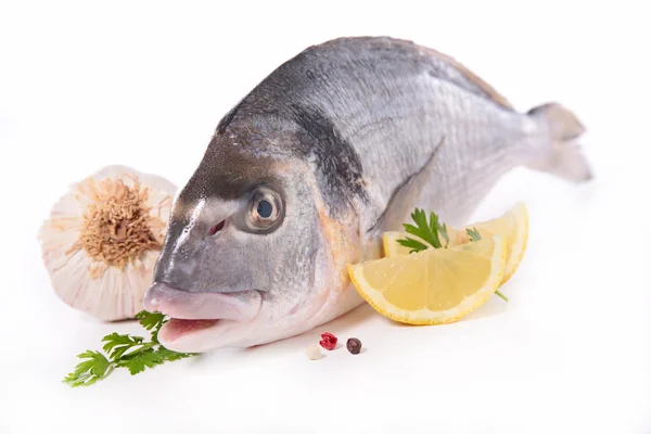 Raw fish with lemon and spices — Stock Photo, Image