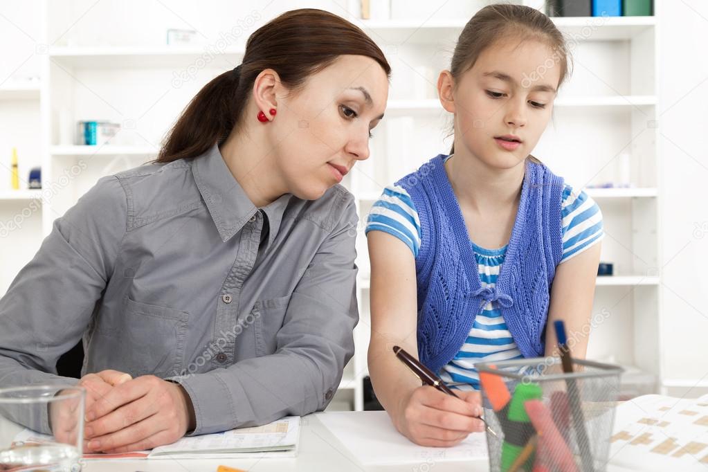 Mother Helping Daughter With Homework.