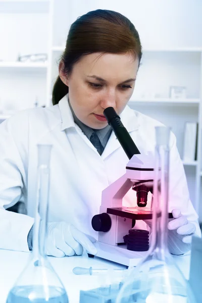 Serious female chemist working in laboratory — Stock Photo, Image