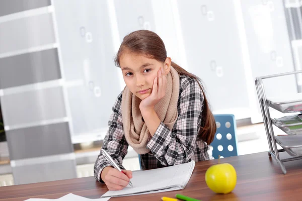Little girl working on her school project at home. — Stock Photo, Image