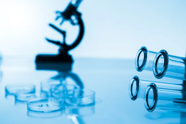 Test tubes closeup.. medical glassware.Pipette adding fluid to one of several test tubes .medical glassware . — стоковое фото