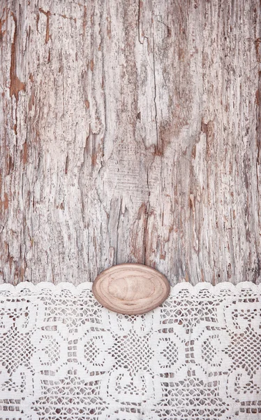 Vintage bakgrund med spets på gamla trä — Stockfoto